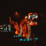 Illuminated dragon lights up the night at a colorful lantern festival.